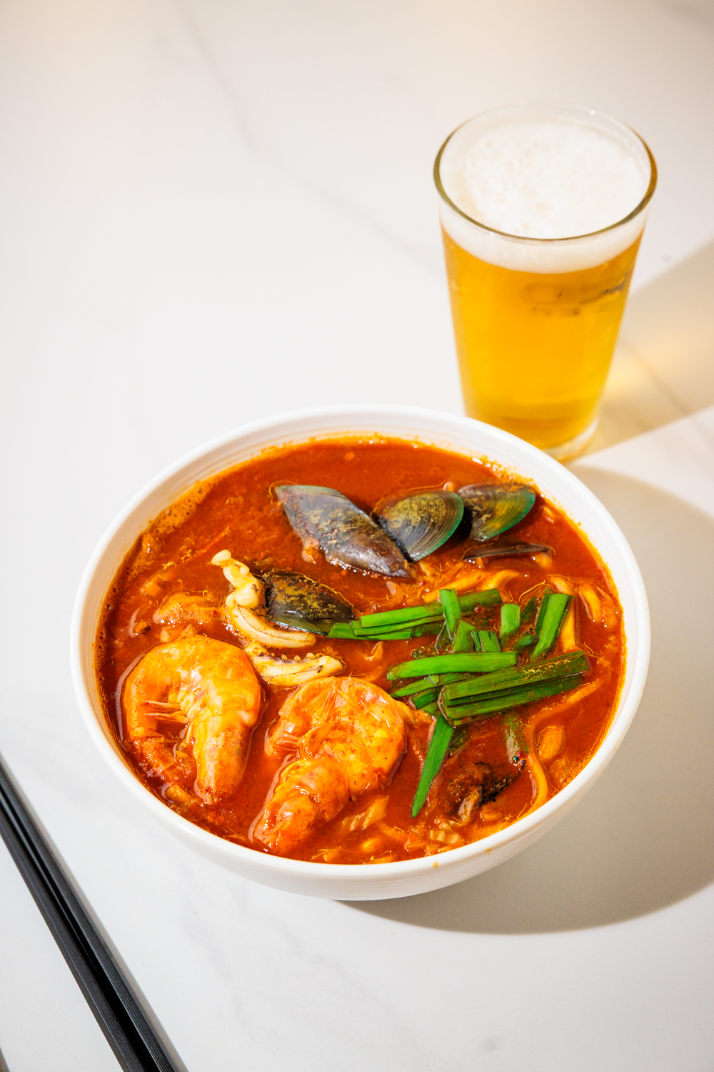 Spicy seafood noodle soup — shrimp, squid, mussels